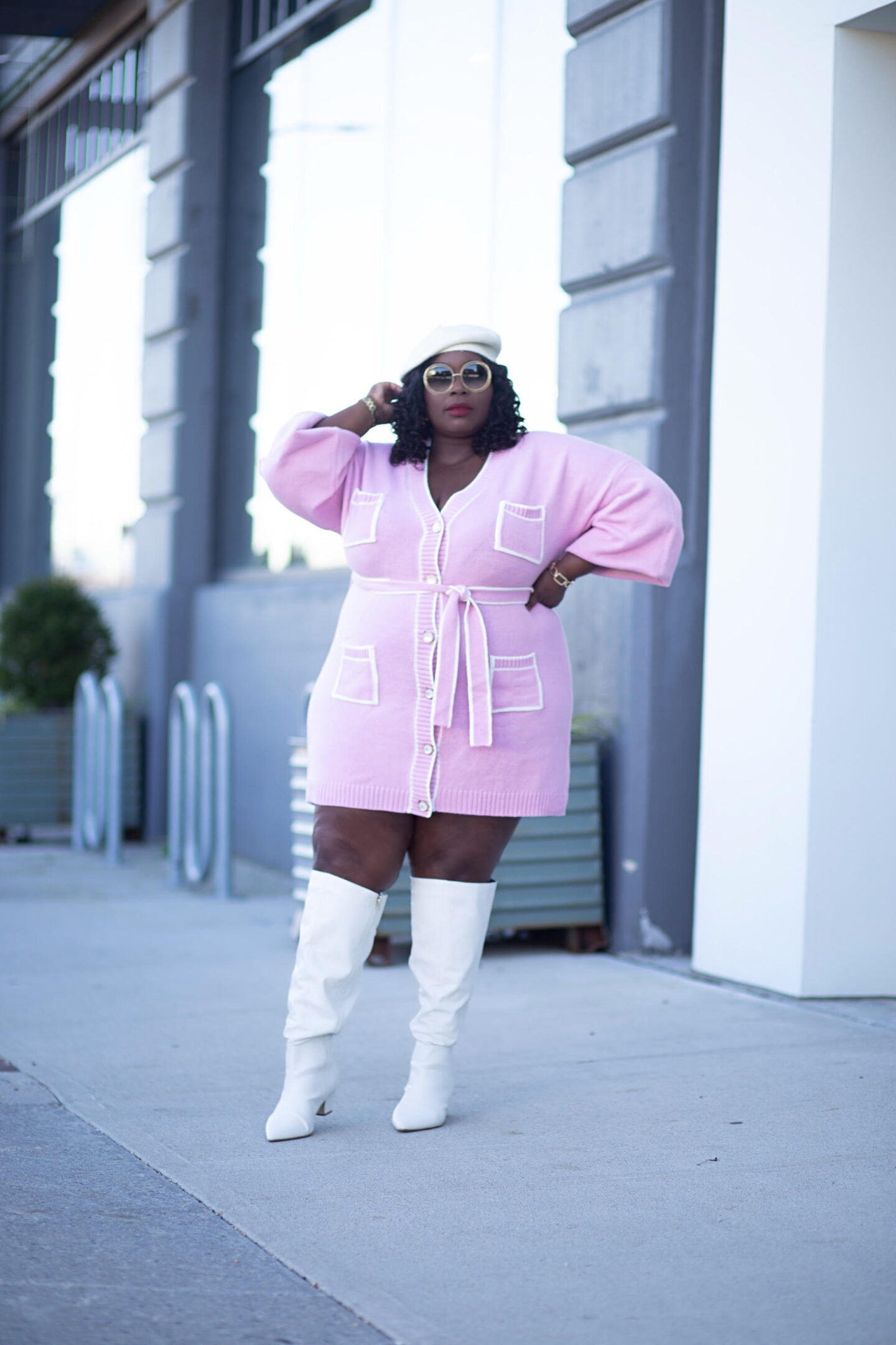Here's a few ways to style a sweater dress. This mini plus size sweater dress looks perfect with white knee high boots and a beret.