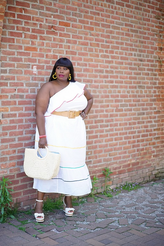 Lane Bryant spring dresses. Stylish Curves in a white one shoulder ruffled hem dress with wedges and a straw bag