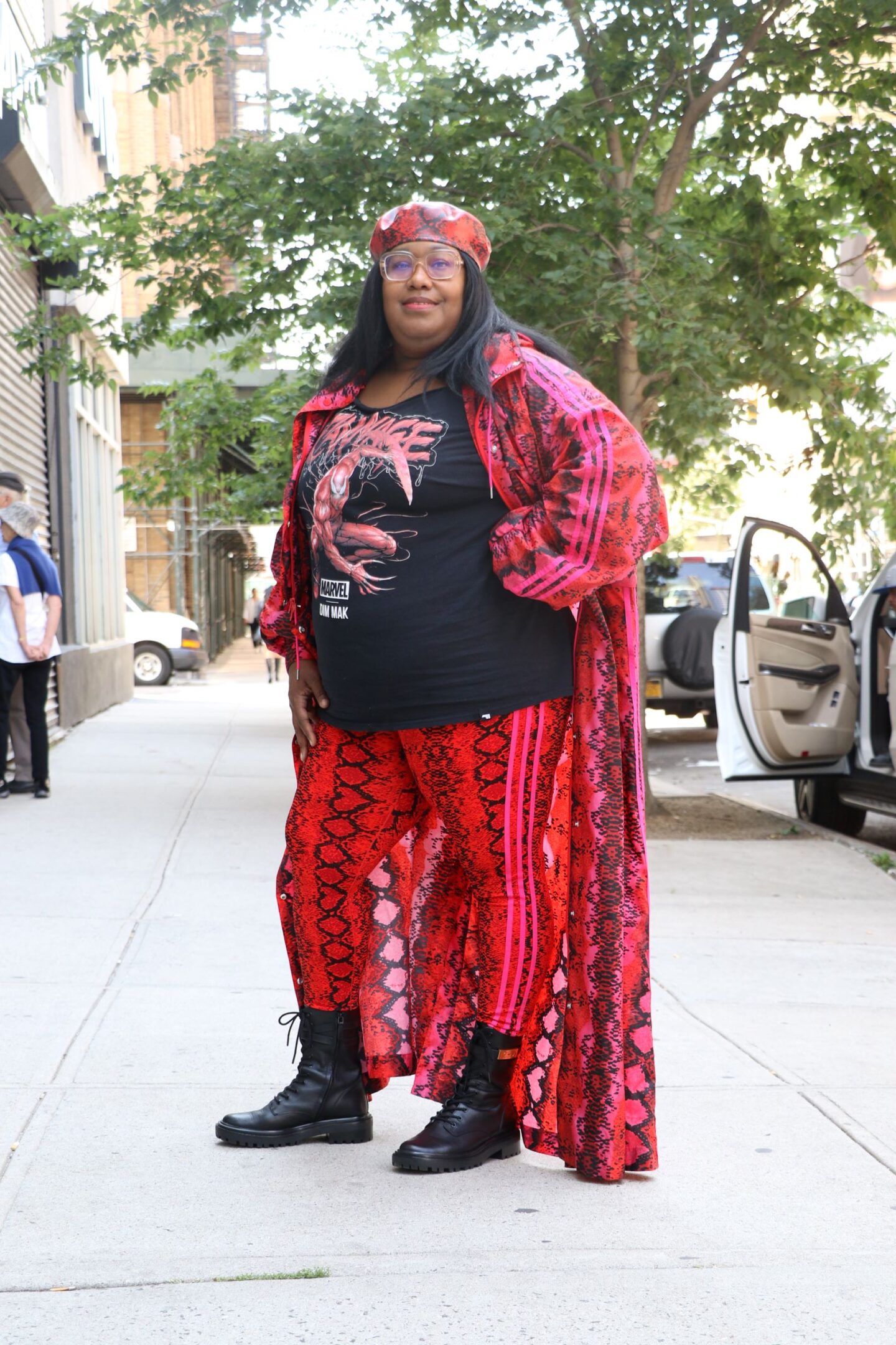 influencer wears a plus size snakeskin trench and snakeskin pants from Adidas and Ivy Park collection to new york fashion week plus size street style