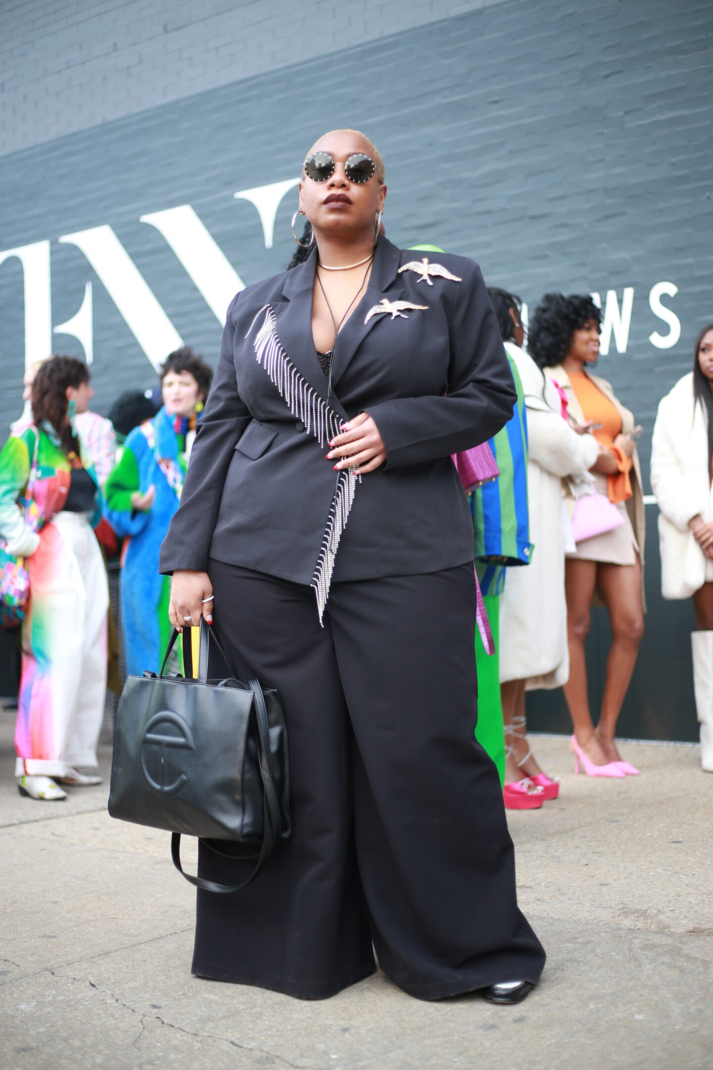 Kelly augustine in a black blazer with fringe detail.

 plus size street style outfits at new york fashion week

Photo credit: Tip.Raw