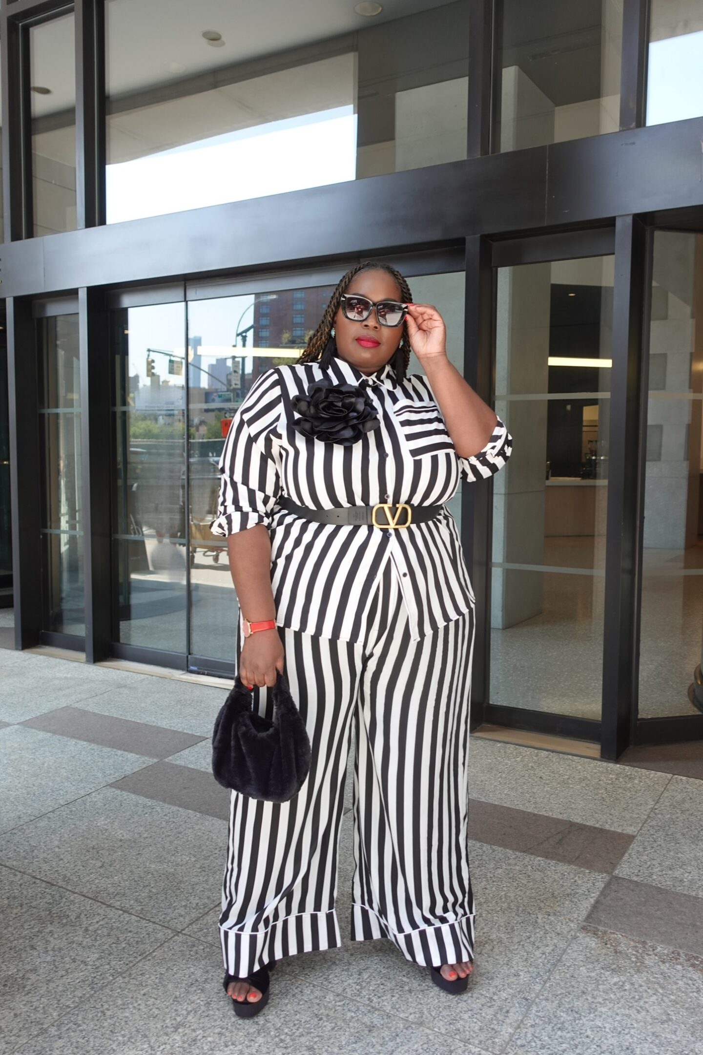 Editor Alissa Wilson in black and white stripe pants set from rebdolls at New York Fashion Week