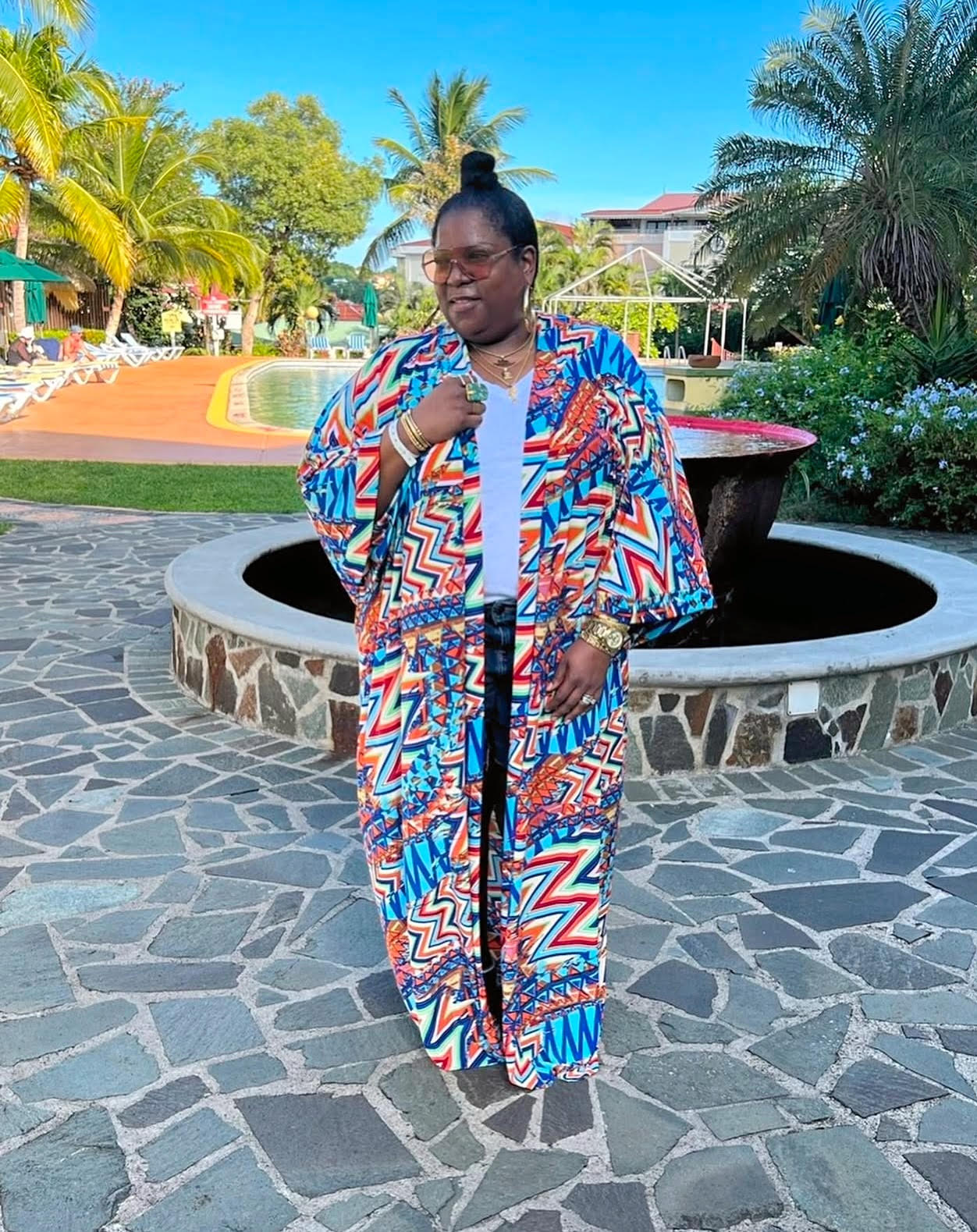 plus size woman wearing a colorful maxi kimono 